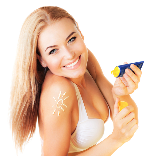 woman using sunscreen